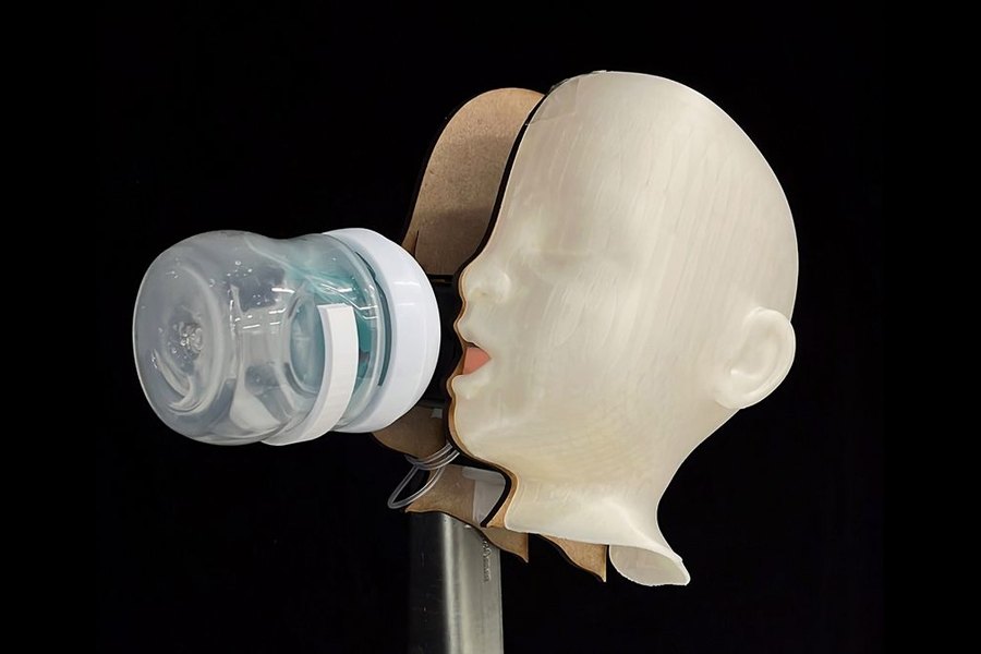 BabyBot robot with an infant-like head and feeding bottle